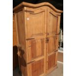 Rustic pine double door wardrobe with wrought metal straps and arched top (118cm x 61cm x 192cm)