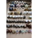 Collection of bone china and Jasperware thimbles including Coalport, Wedgwood and pewter