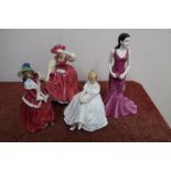 Four Royal Doulton figures 'Heather' No. HN2956, 'Buttercup' No. HN2399, 'Christmas Morn' No. HN1992