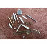 Three silver folding fruit knives with Mother of Pearl handles, propelling pencils and other items