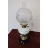 Edwardian oil lamp with opaque glass reservoir on turned circular base (55cm high)