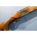 Baikal 12 bore over and under shotgun with 2 3/4 inch chambers, 28 1/2 inch barrels, 14 1/2 inch