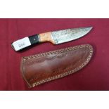Boxed Damascus bladed sheath knife with 3 3/4 inch blade and two piece burr wood grips with