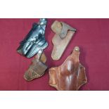 Group of four leather pistol holsters