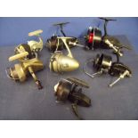 Collection of seven vintage spinning reels including J.W. Young & Sons Ambidex casting reel,