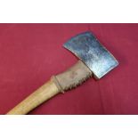 Sheffield steel axe with wooden shaft and leather mounts with traces of stamped detail to the