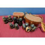 Four various pairs of binoculars, two with leather cases, early-mid 20th C including French and Carl