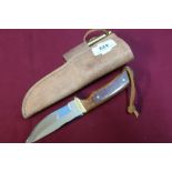 Sheffield made sheath knife with 3 1/2 inch blade, two piece grip complete with leather belt