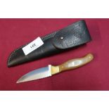 Sheffield made sheath knife with 3 1/4 inch blade, with two piece brass mounts and grips and leather