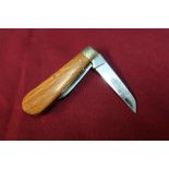 Twin bladed pocket knife with wooden grips by Rogers of Sheffield