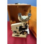 Wooden cased Russian Lomo binocular microscope in fitted case with key, with light source and all