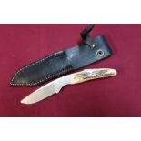 I and J Barber of Sheffield skinning knife with 2 1/2 inch blade, two piece antler grips and leather