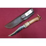 Colt of Sheffield sheath knife with 4 inch blade, wooden grip and leather belt sheath