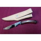 Small Harry Bowden sheath knife with 2 1/2 inch blade, two piece wooden grips and leather belt