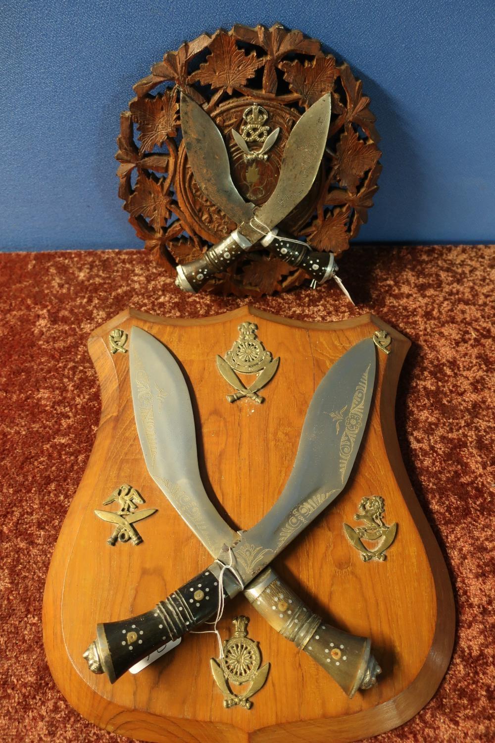 Carved wood wall plaque mounted with two Kukri type knives with a crowned Staffordshire Gurkha