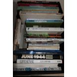 Box containing a quantity of mostly hardback military and gun related books including Manual Clay