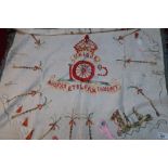 Large circa WWI embroidered table cloth with Egyptian type scenes and Royal Artillery cap badge