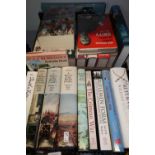 Two boxes containing a quantity of mostly hardback military related history and novels