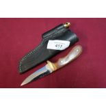 Small Sheffield made sheath knife with 3 inch blade and two piece grips complete with leather belt