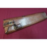 Tan leather Cavalry holster with brass locking strap and sword mount attachment