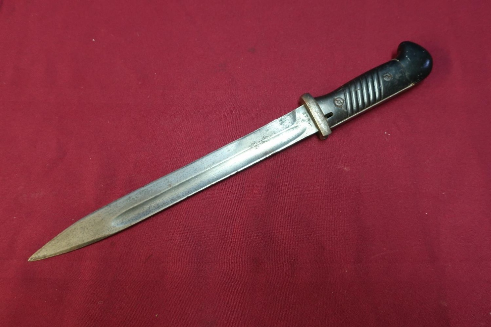 German style bayonet, the handle converted to a combat knife with 9 3/4 inch single fullered blade