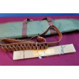 Padded gun slip, tan leather cartridge belt and a Lindop gun cleaning kit