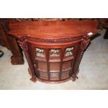 Mahogany bow front wall cabinet with single cupboard door and barley twist column supports, with