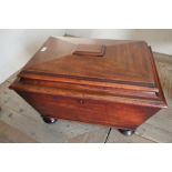 19th C mahogany rectangular cellarette with hinged stepped top, with tin liner, mounted on bun