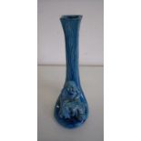 Early 20th C Studio ware stem vase mounted with a figure of a Buddha type deity (height 20cm)