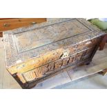 Carved rectangular Camphor wood box with hinged top and oriental scenes, on lion paw supports (100cm