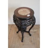 Chinese hardwood jardiniere stand with inset hard stone panel to the top, with elaborately carved