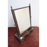 Early 19th C mahogany serpentine front free standing dressing table mirror on raised supports,