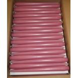 Approximately 200 boxed as new old rose coloured tapered dining candles