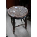 Elm circular top country style stool on four turned supports