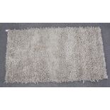 Tufted beige ground wool rug (150cm x 82cm)