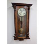 Late 19th C/early 20th C German double weight Vienna wall clock, the case with carved fluted half