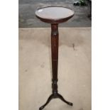 Mahogany circular top jardiniere stand on three out-splayed supports and fluted column (138cm high)