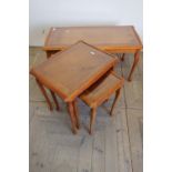 Yew wood rectangular coffee table with inset glass top and a matching nest of three occasional