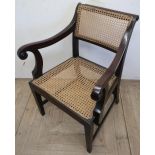 Early 19th C mahogany framed armchair with cane work seat and back, with H shaped under stretcher on