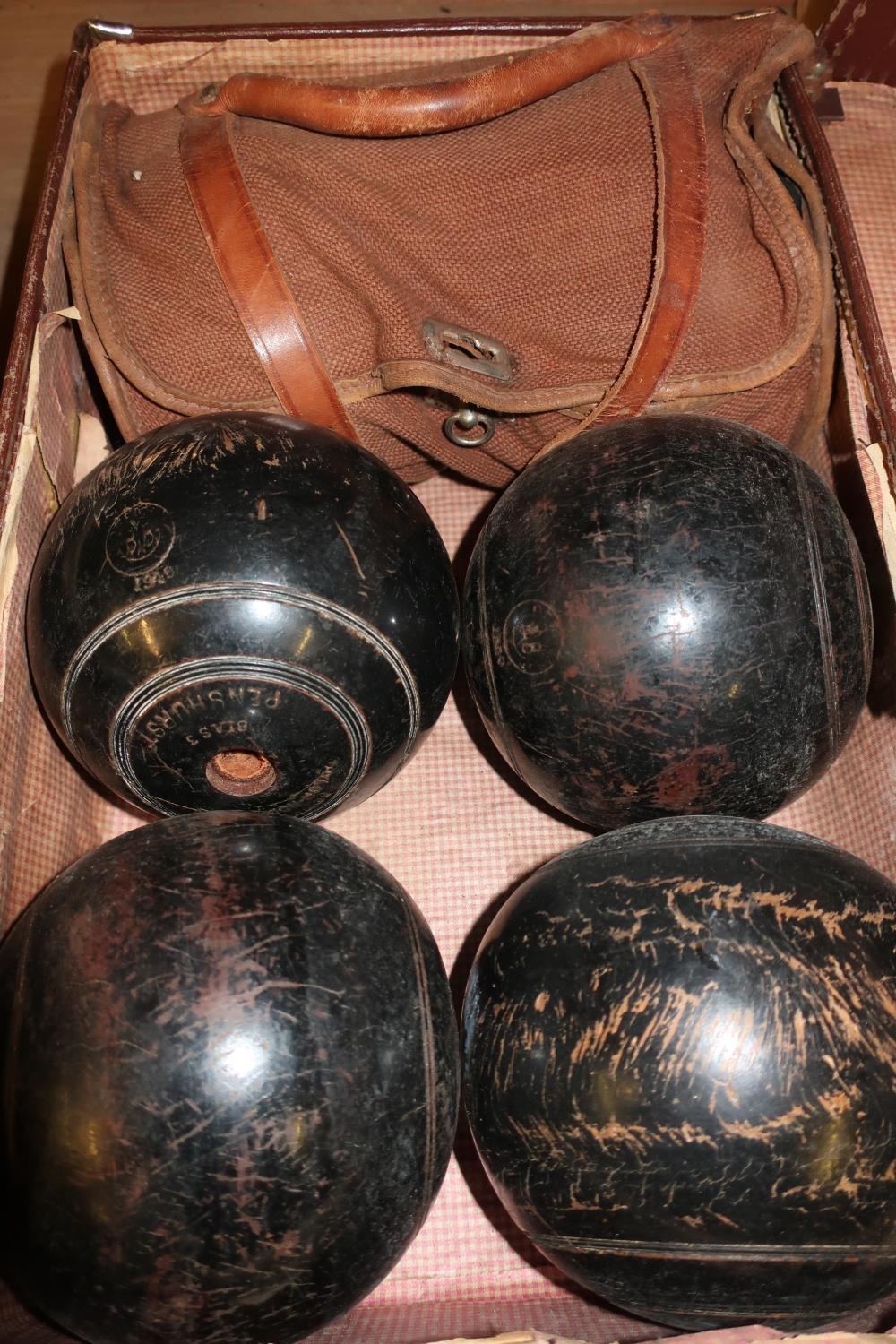 Small vintage case with six wooden bowling green balls