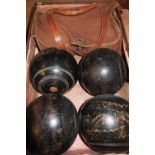 Small vintage case with six wooden bowling green balls