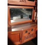 Art Nouveau light oak dresser with raised bevel edged mirror back and carved detail, with central