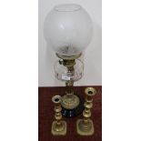Late Victorian oil lamp with clear glass reservoir and fluted column on glazed porcelain base, and