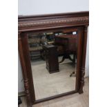 Late Victorian oak rectangular over mantel mirror with bevelled edge mirror panel and fluted