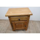 Modern light oak side cabinet with single drawer above panelled cupboard door (54cm x 35cm x 66cm)