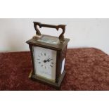 Brass cased carriage clock with key, the dial marked The Chester Carriage Clock Company (12cm high)