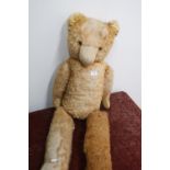 Very large vintage straw filled teddy bear with wire joints (A/F) with some damage, in need of a