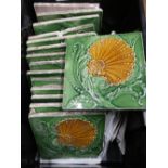 Fifteen assorted 19th/20th C green glaze floral pattern ceramic wall tiles