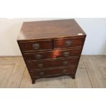 Mahogany inlaid chest of small proportions comprising two short above three long drawers (61cm x