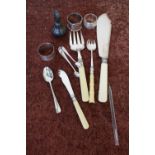 Three silver hallmarked napkin rings, a pair of silver hallmarked sugar tongs, a selection of